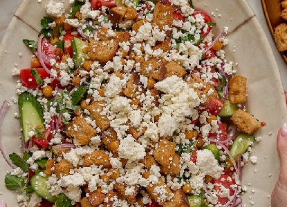 Greek Salad with Bread Croutons and Chickpeas (on a baking sheet)